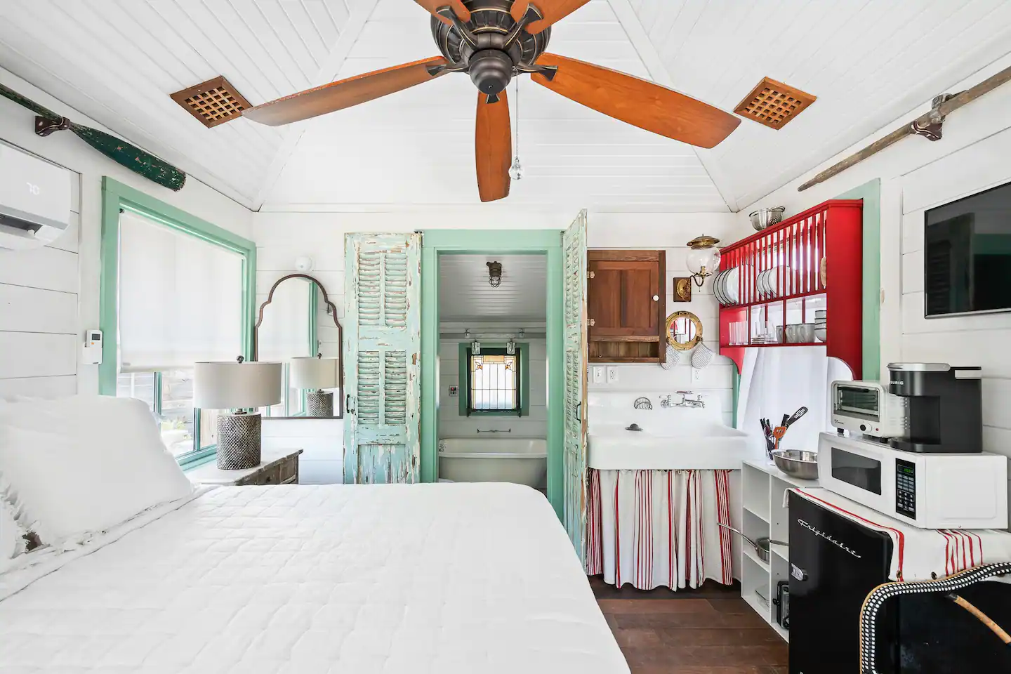 The inside of the house has a queen-size bed.
