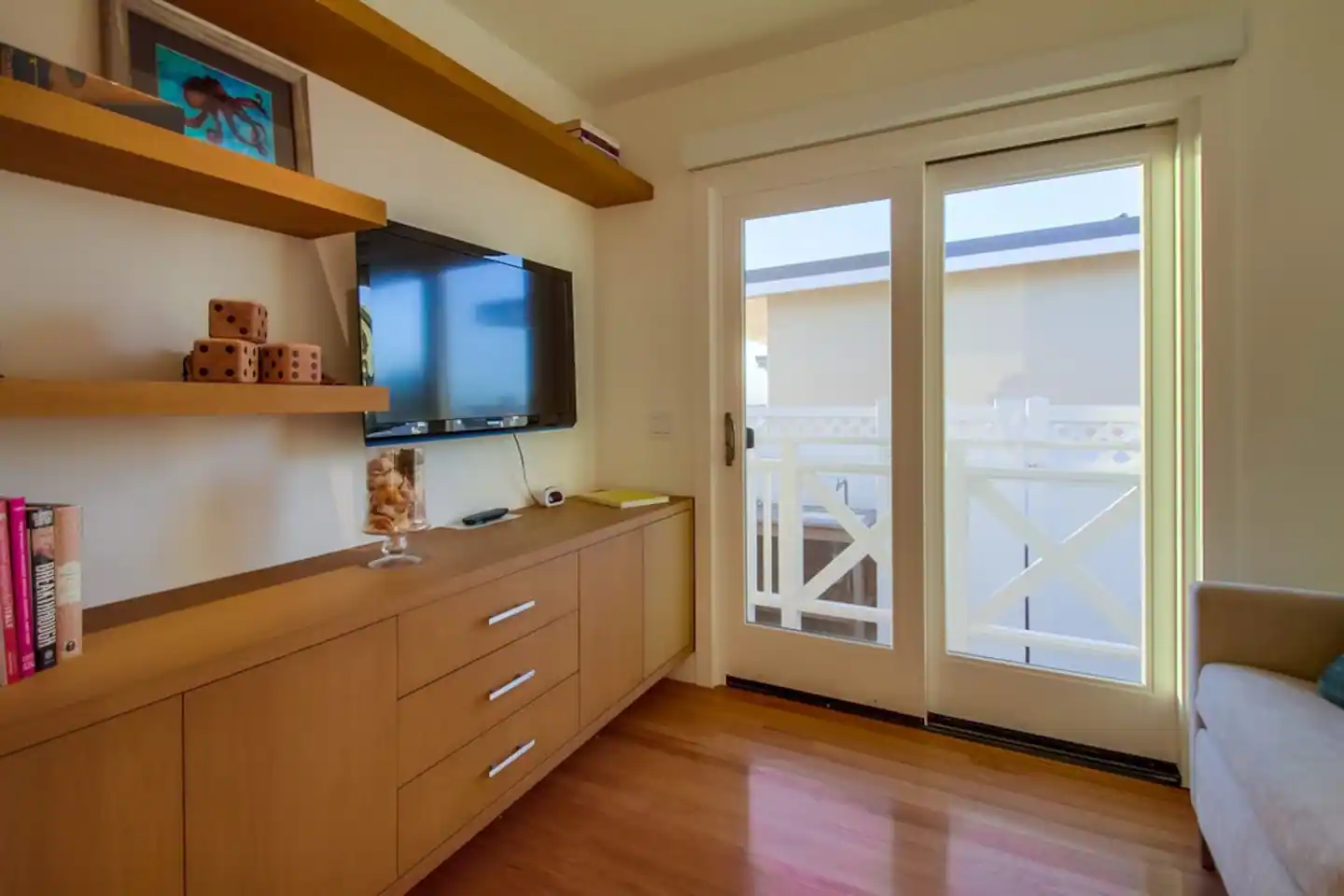 2nd Bedroom with TV, sofa sleeper, & sliding glass doors with access to the side & front patios!