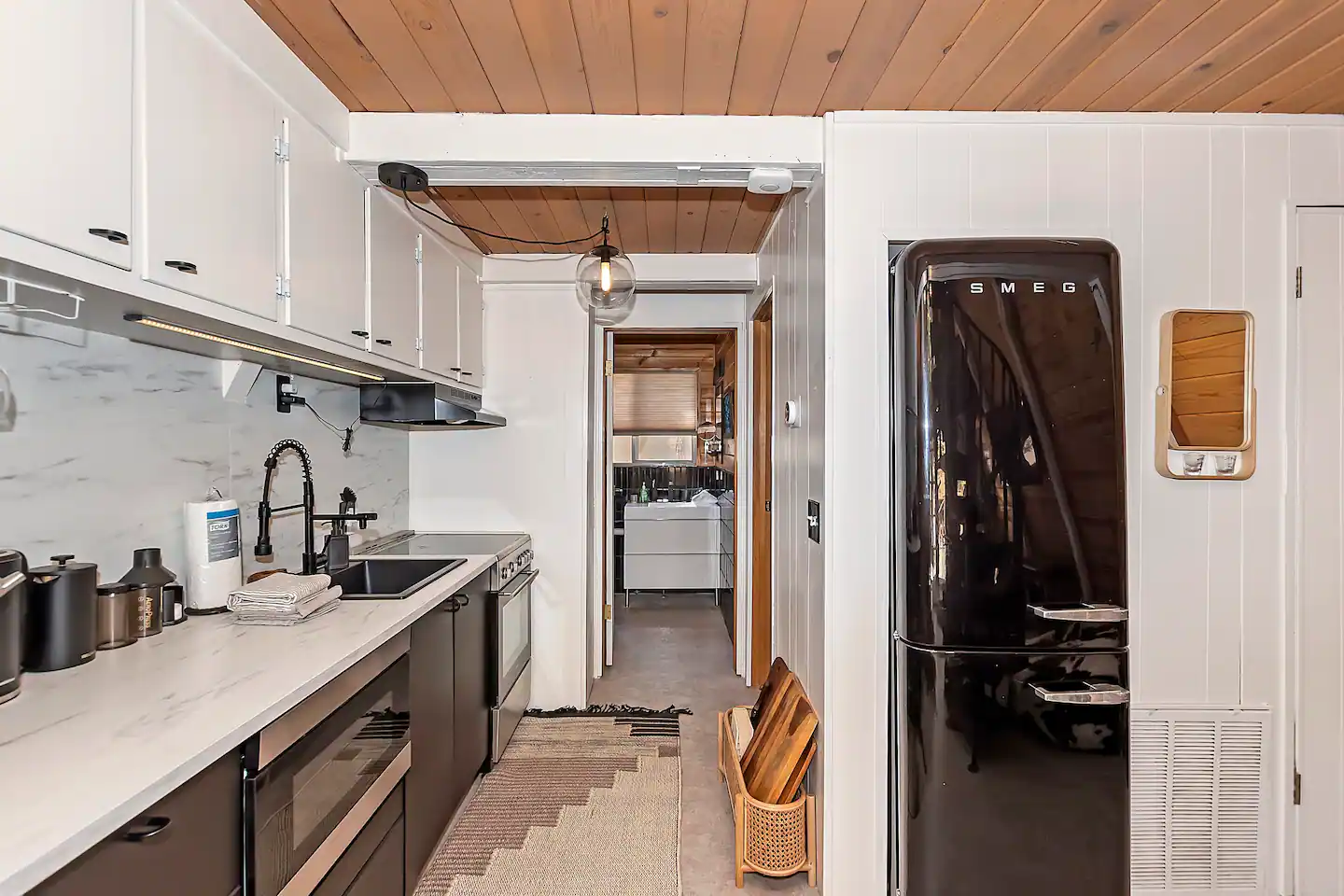 The kitchen is fully supplied with everything you'll need to enjoy your stay.