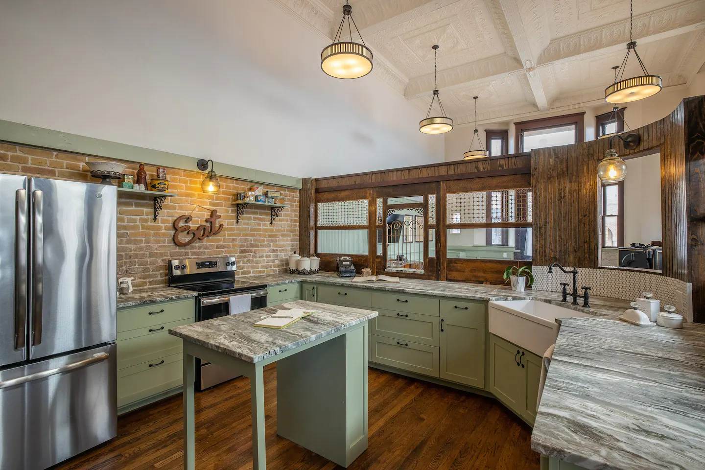 A kitchen in the former teller station, with the teller walls still standing