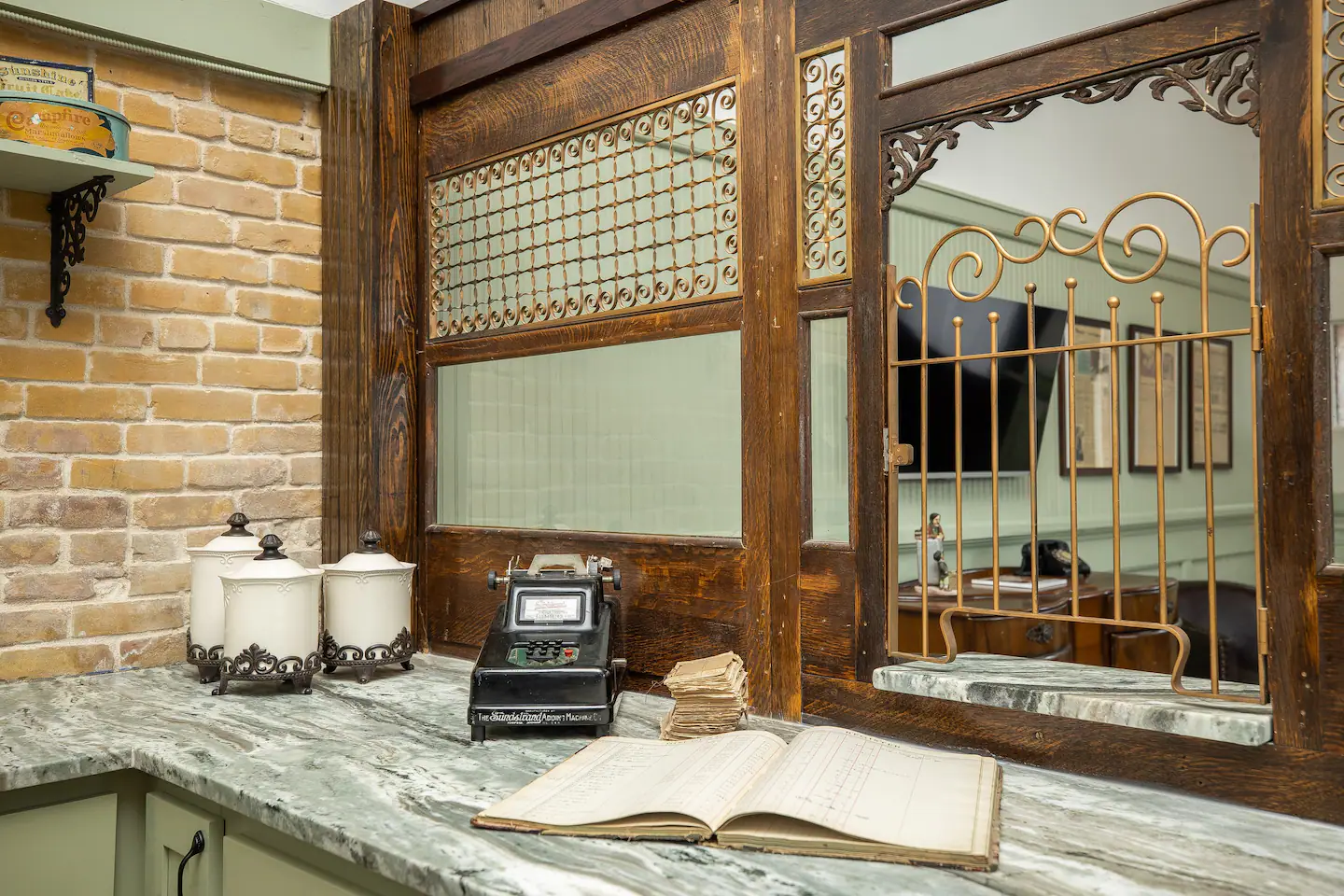 A kitchen in the former teller station, with the teller walls still standing