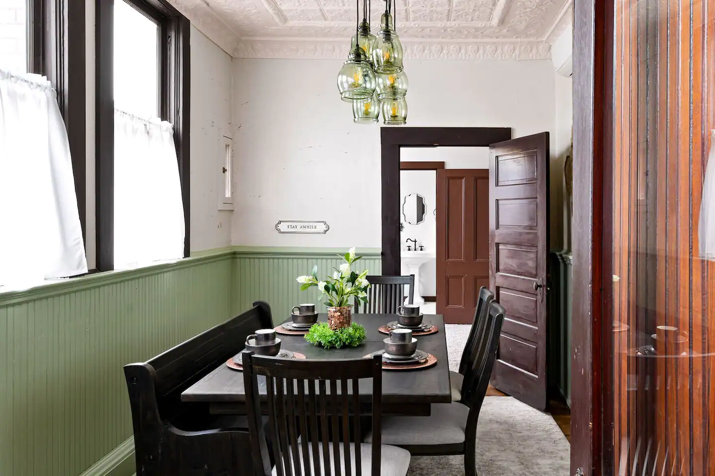 A kitchen in the former teller station, with the teller walls still standing