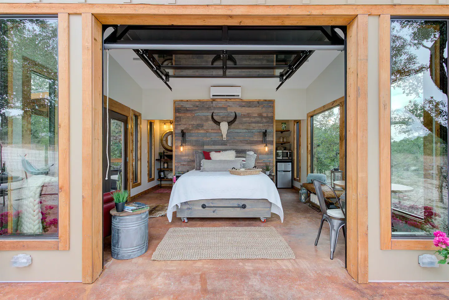 The garage door opens to let in fresh air or to move the bed out onto the porch!