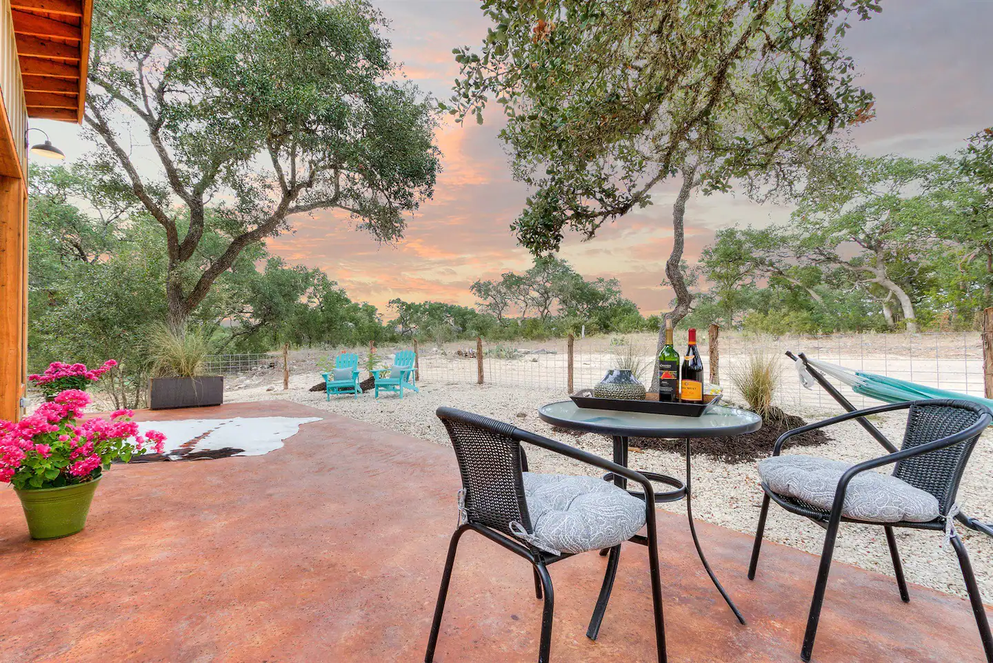 There is plenty of outdoor seating available, including a table for dining on the patio.