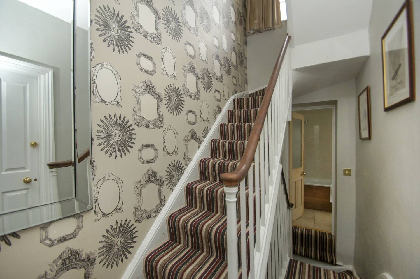 The stairs leading to upper floor.