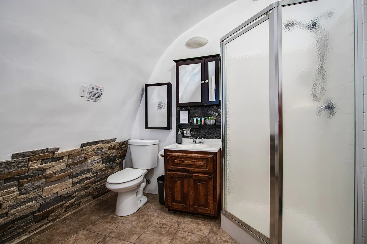 Bathroom with stocked towels, shampoo and conditioner, and hand soap