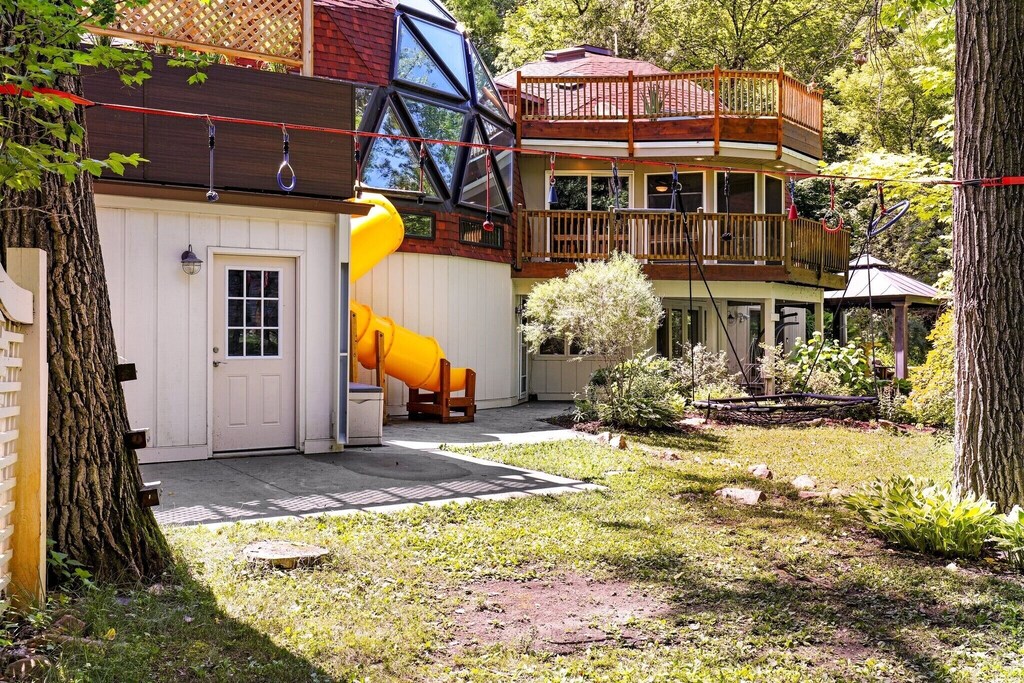 There is also a trampoline for the kids (and adults:), a playhouse with a slide, and a tiki bar and dining set in the garden.