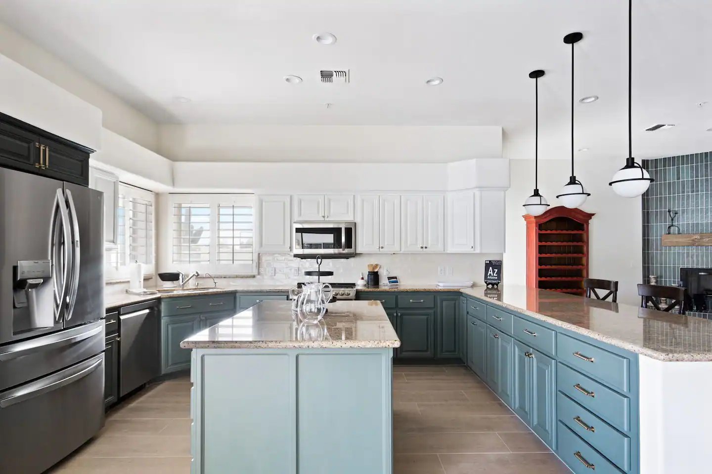 The kitchen is fully equipped and includes a central island for convenience.