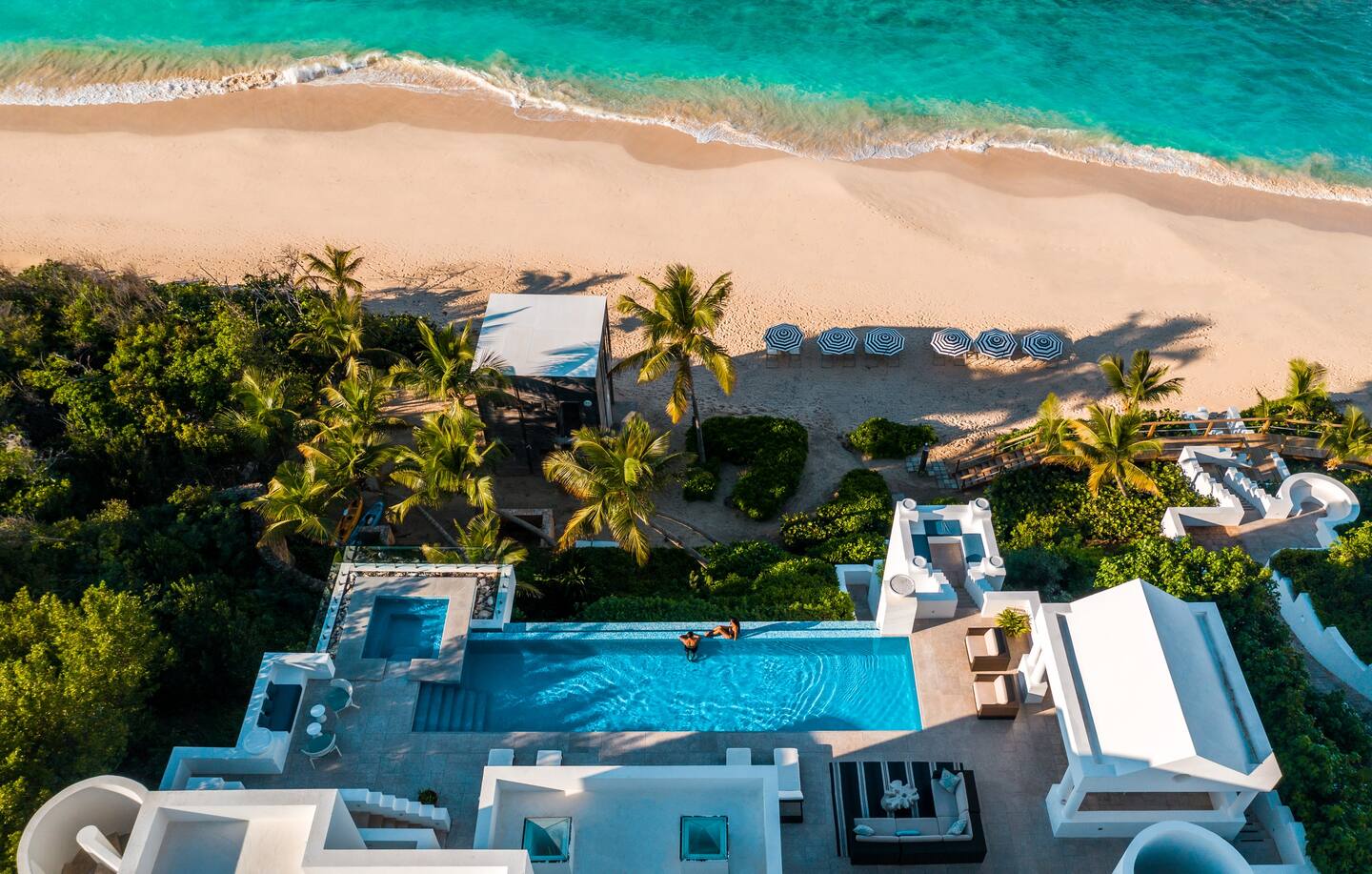 A captivating aerial view of the luxurious villa, highlighting its beautiful surroundings and expansive design.