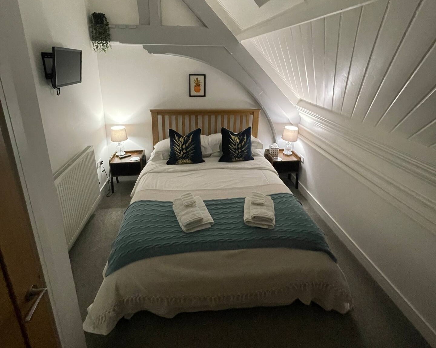 The Pineapple Room. Comfy king size bed, chest of drawers, hanging space, hot water bottles. Smart tv and Amazon Dot.